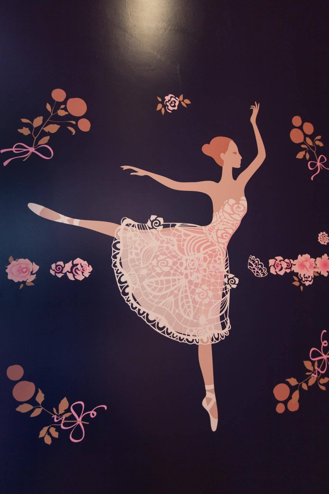 A ballerina mural with flowers