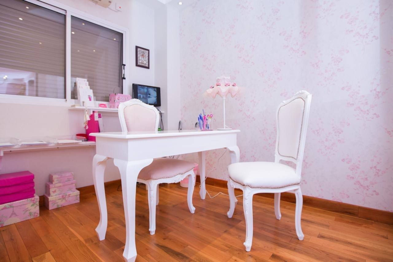 The reception desk with white chairs